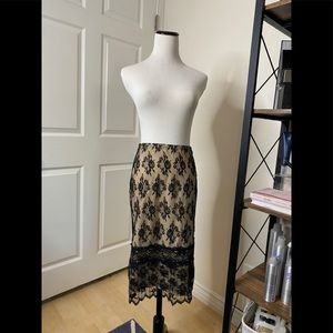 Laced midi skirt with nude underlay